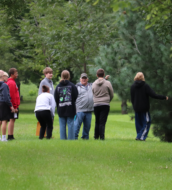 Todd Stewart, LENRD Natural Resources Technician, teaches students about the importance of trees and identifies species with a fun-filled scavenger hunt.